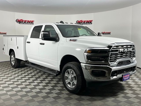 white 2026 RAM 3500 truck with a service body upfit parked at the Keene CDJR dealership in Jarrettsville, MD