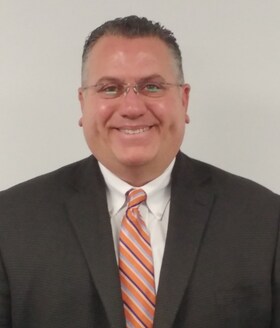 Staff member MIKE NORMAN from f17a1ab965b1