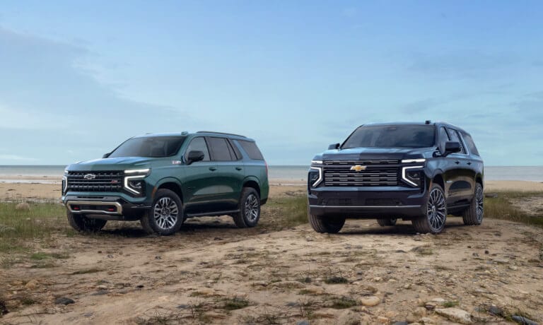 Two 2025 Chevy Tahoes parked at a beach