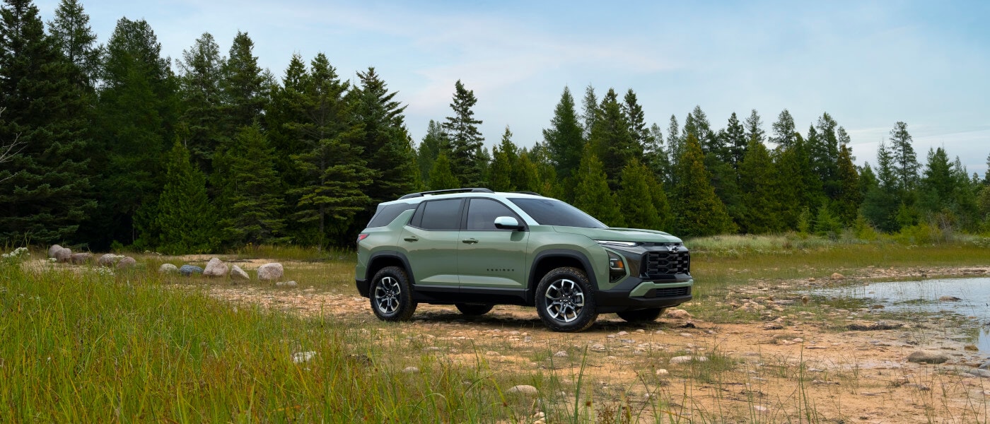 2025 Chevy Equinox parked on a rocky shoreline
