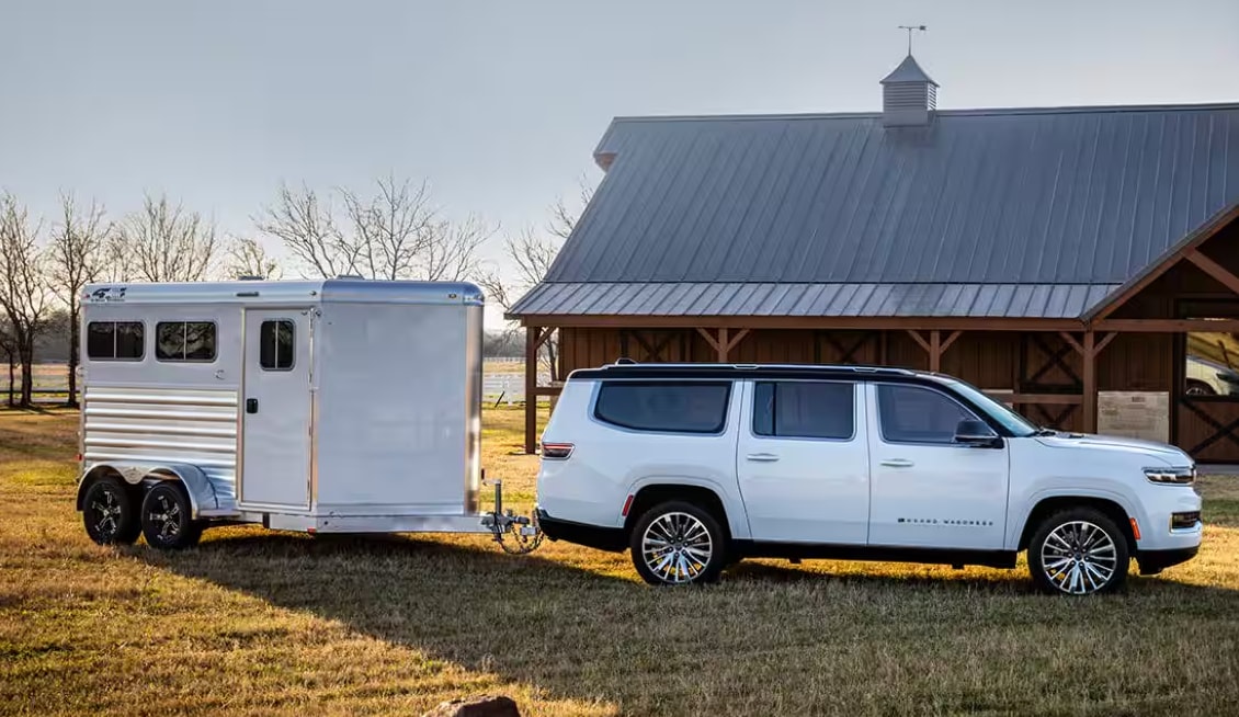 New Grand Wagoneer L with Trailer in back