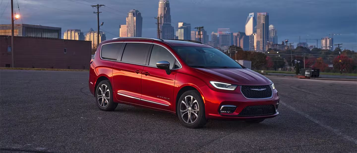 A red pacifica sitting parked.