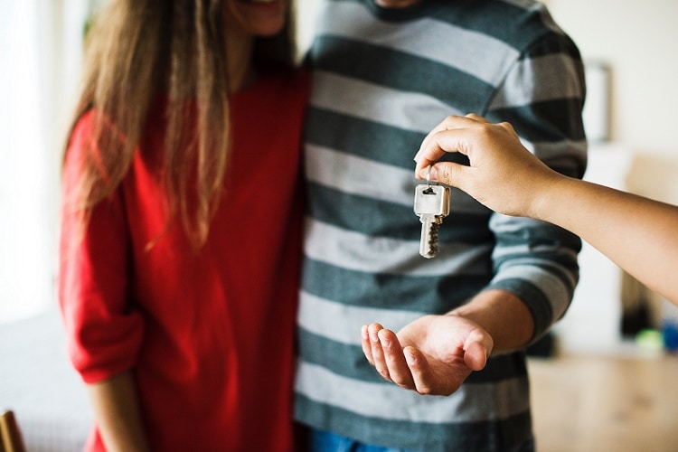 Couple with keys Directions to Kendall Budget Sales