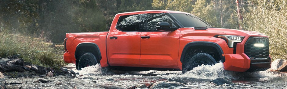 A Tundra driving through water