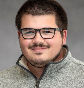 Staff member Adam Williams from ID_424390