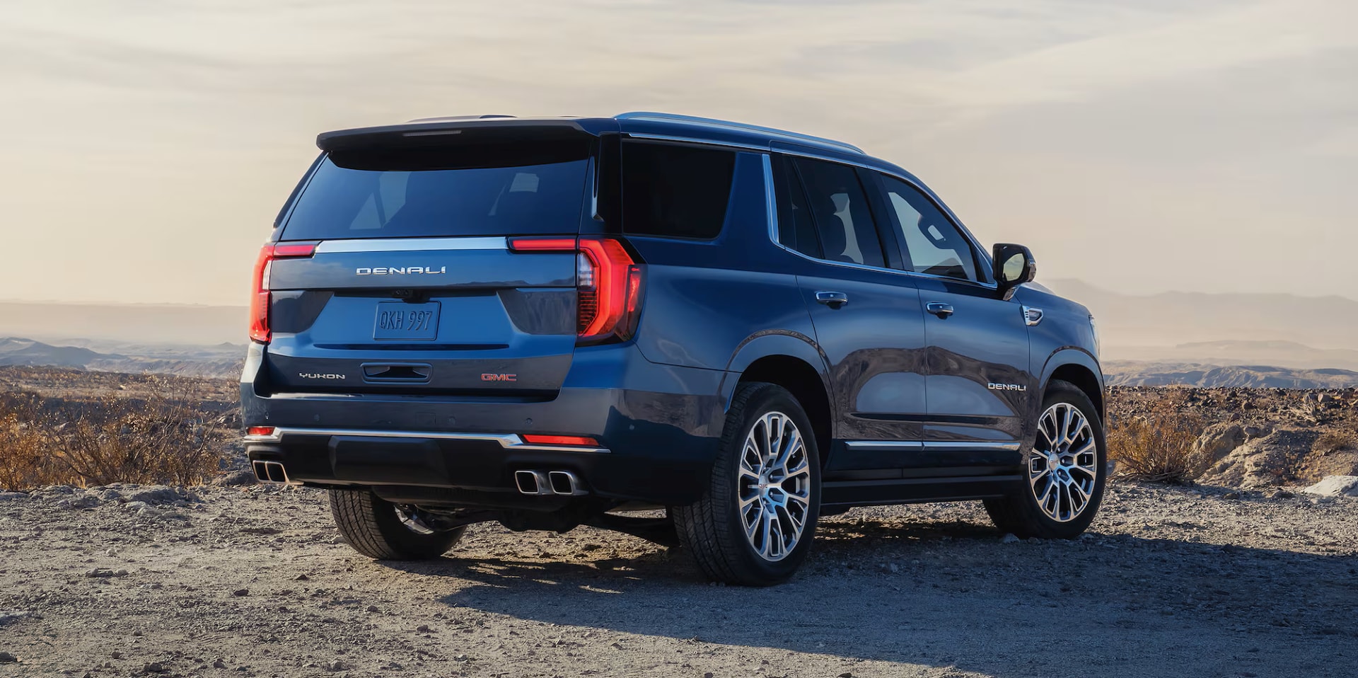 2026 GMC Yukon rear view parked in the desert