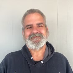 Staff member Dennis Corbet from ID_78454f2d7c91