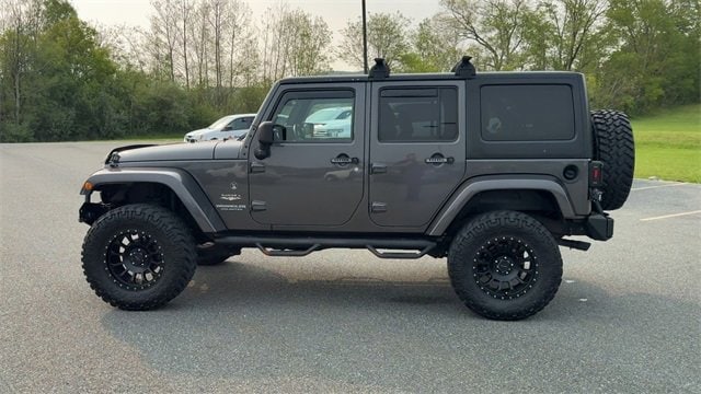 Used 2014 Jeep Wrangler Unlimited Sahara with VIN 1C4BJWEG7EL230428 for sale in White River Junction, VT