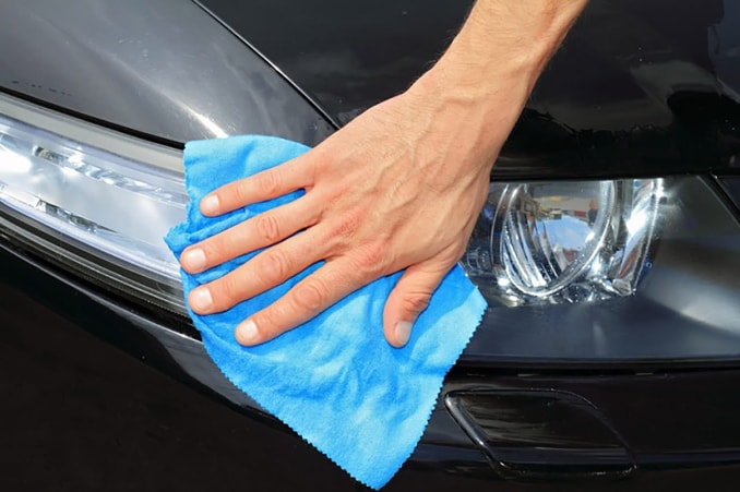 Cleaning_Front_Of_Car (1)-678x451.jpg