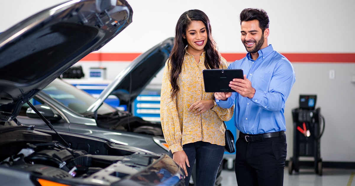 Customer speaking with technician at a Hyundai dealership