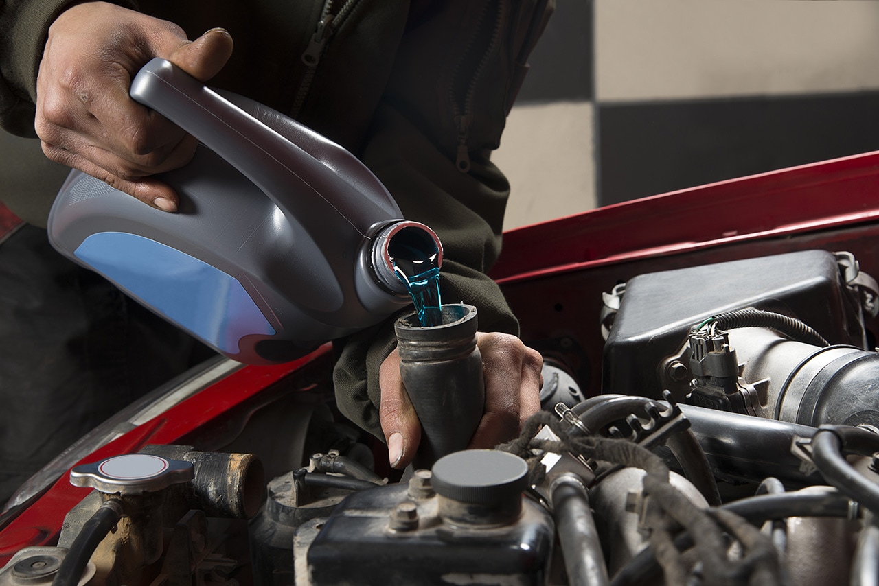 Topping off coolant during a Hyundai service appointment