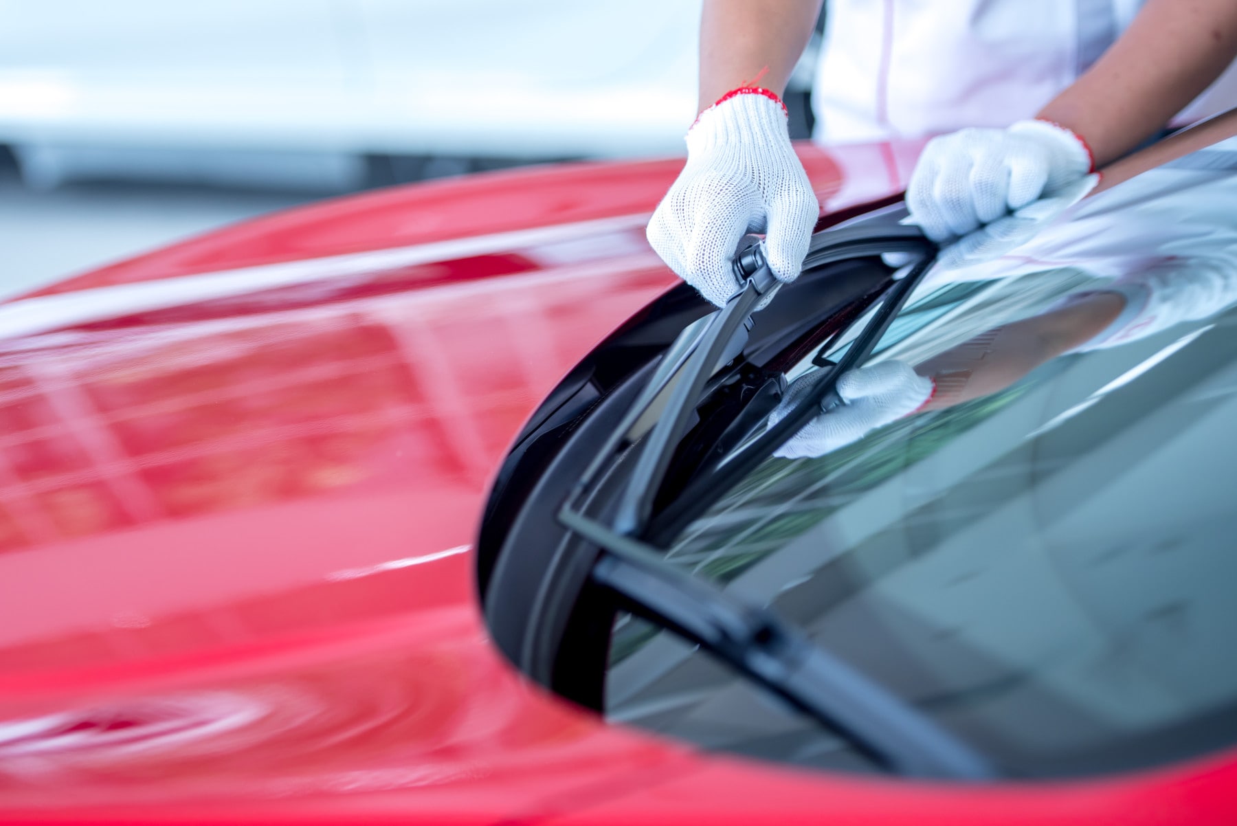 technician changing windshield wipers