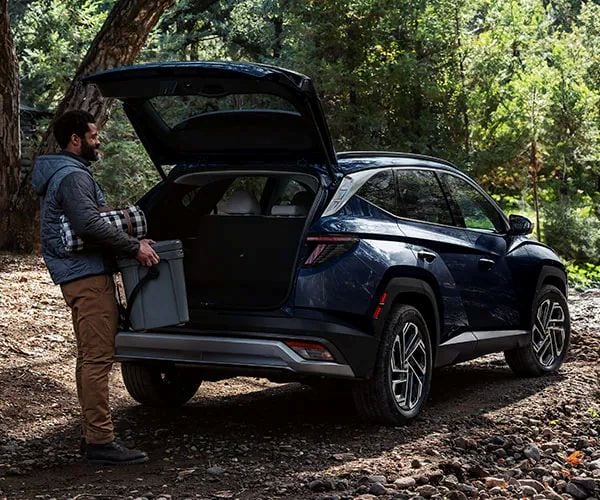 Packing Hyundai Tucson trunk in the woods