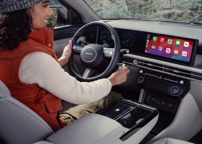 woman driving a 2026 Hyundai Tucson
