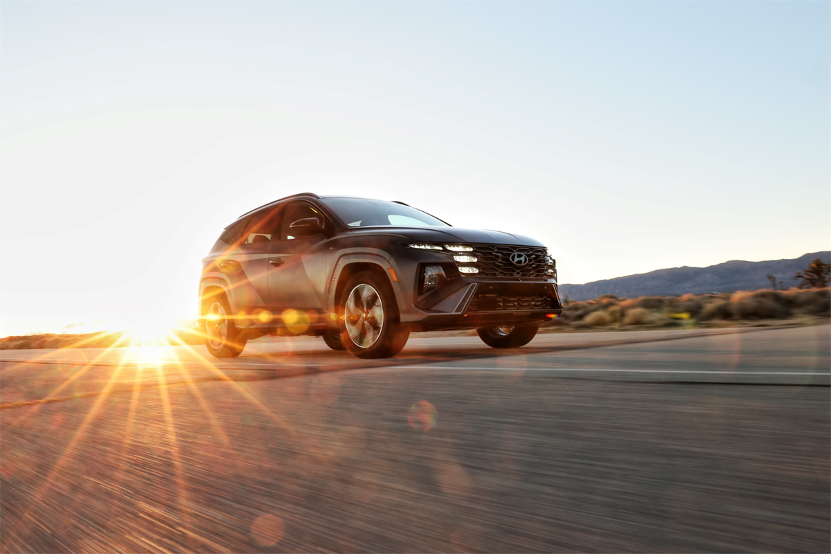 2026 Hyundai Tucson driving at sunset