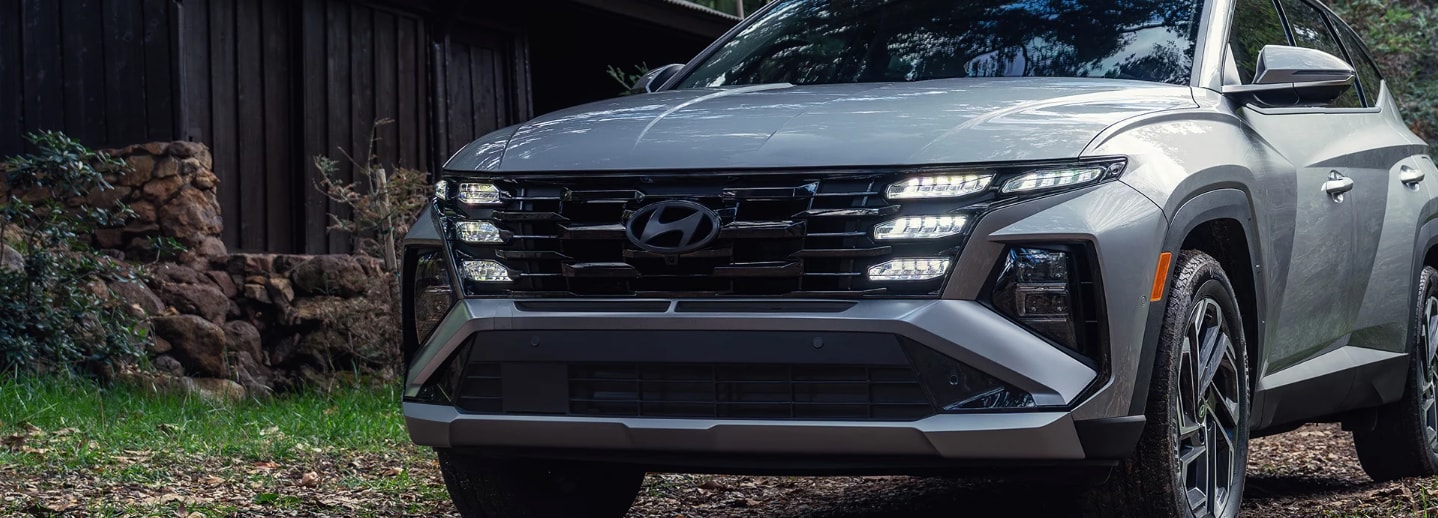 Front view of a 2025 Hyundai Plug-In Hybrid in a woodsy setting