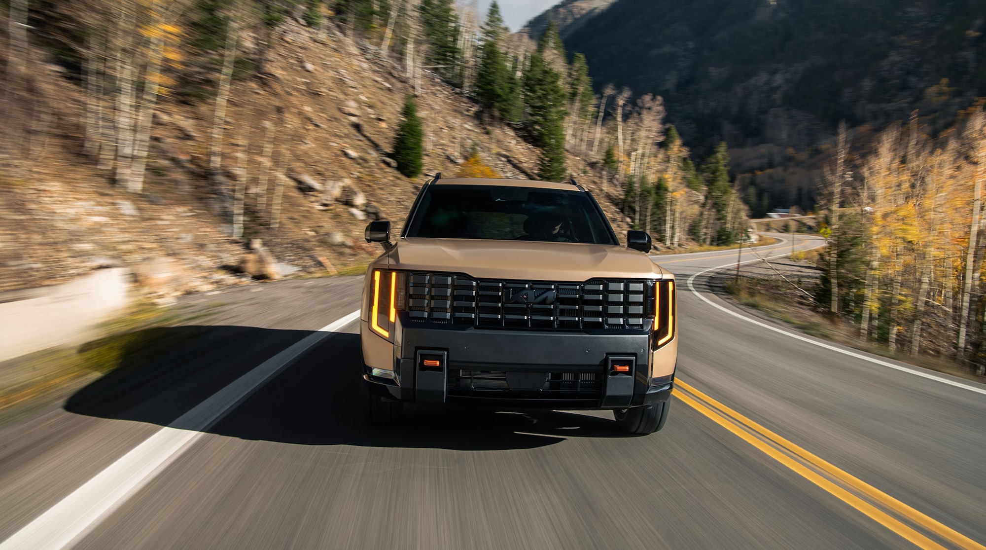 Gloss black auto-dimming and power-folding side view mirrors shown on the X-Pro SX Prestige.