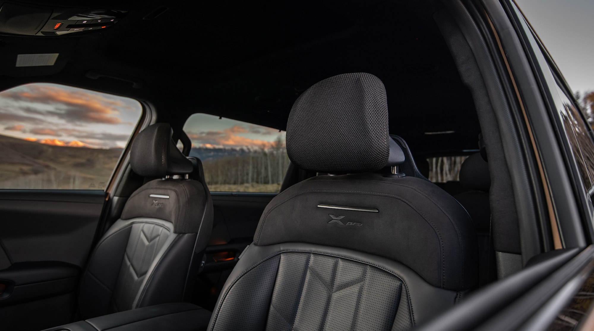 X-Pro embossed front seats, Black SynTex and SynTex suede seat trim, and 4-way adjustable mesh headrests shown on the X-Pro SX Prestige.
