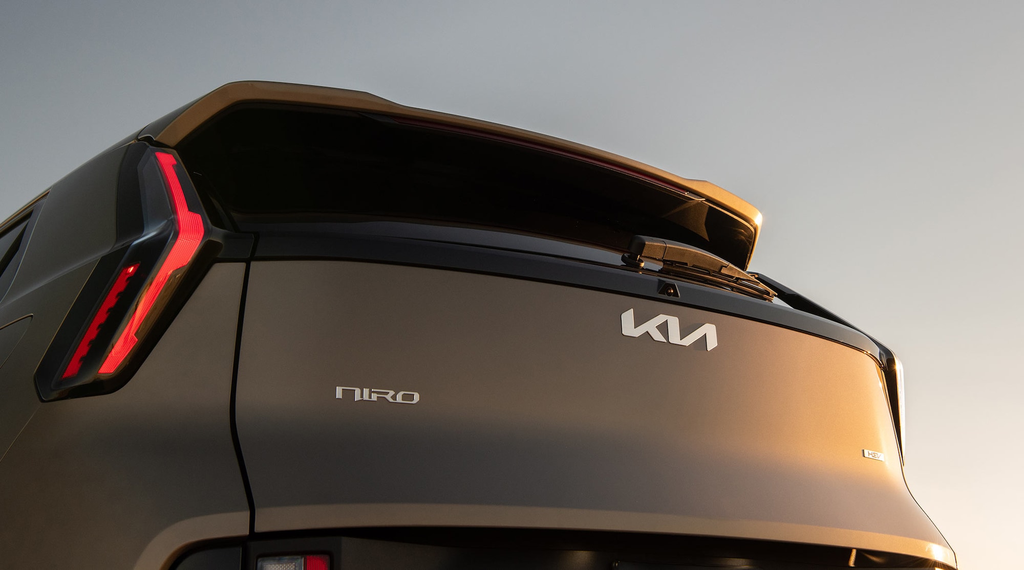 SX Touring shown in Sunset Beige with distinctive satin chrome badging.
