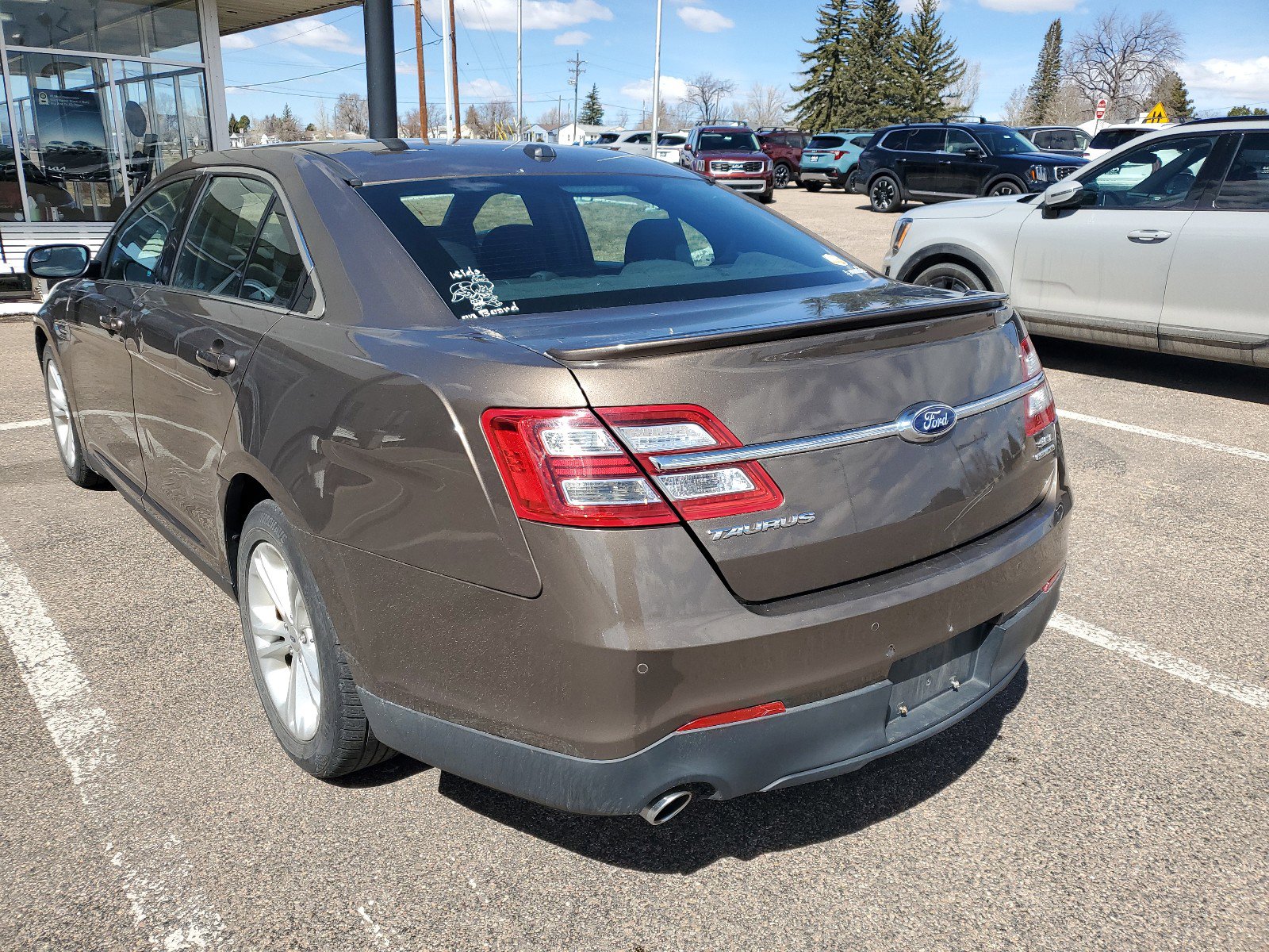 Used 2015 Ford Taurus SEL with VIN 1FAHP2E8XFG122492 for sale in Cheyenne, WY