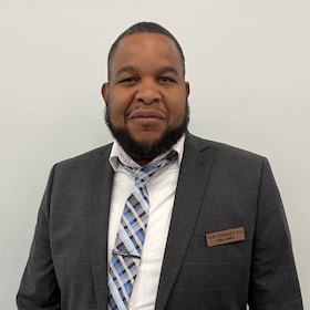 Staff member Oba James from ID_0d8905