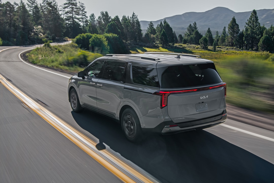  Person cheerfully signing documents.