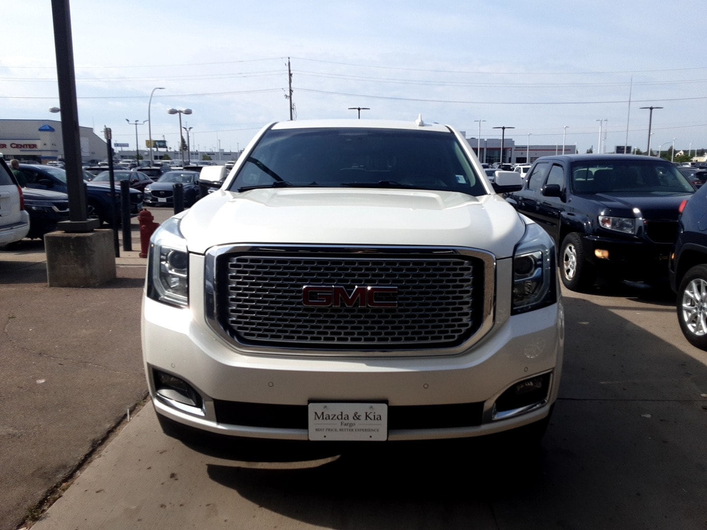 Used 2015 GMC Yukon Denali with VIN 1GKS2CKJ9FR502928 for sale in Fargo, ND