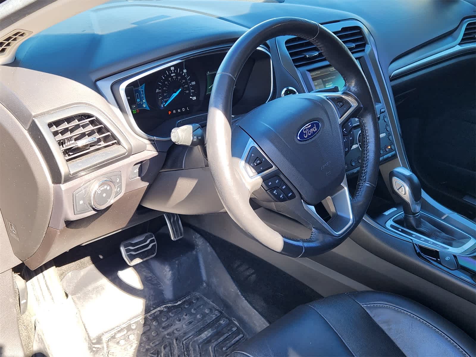 Used 2016 Ford Fusion Hybrid Titanium with VIN 3FA6P0RU0GR316560 for sale in Round Rock, TX