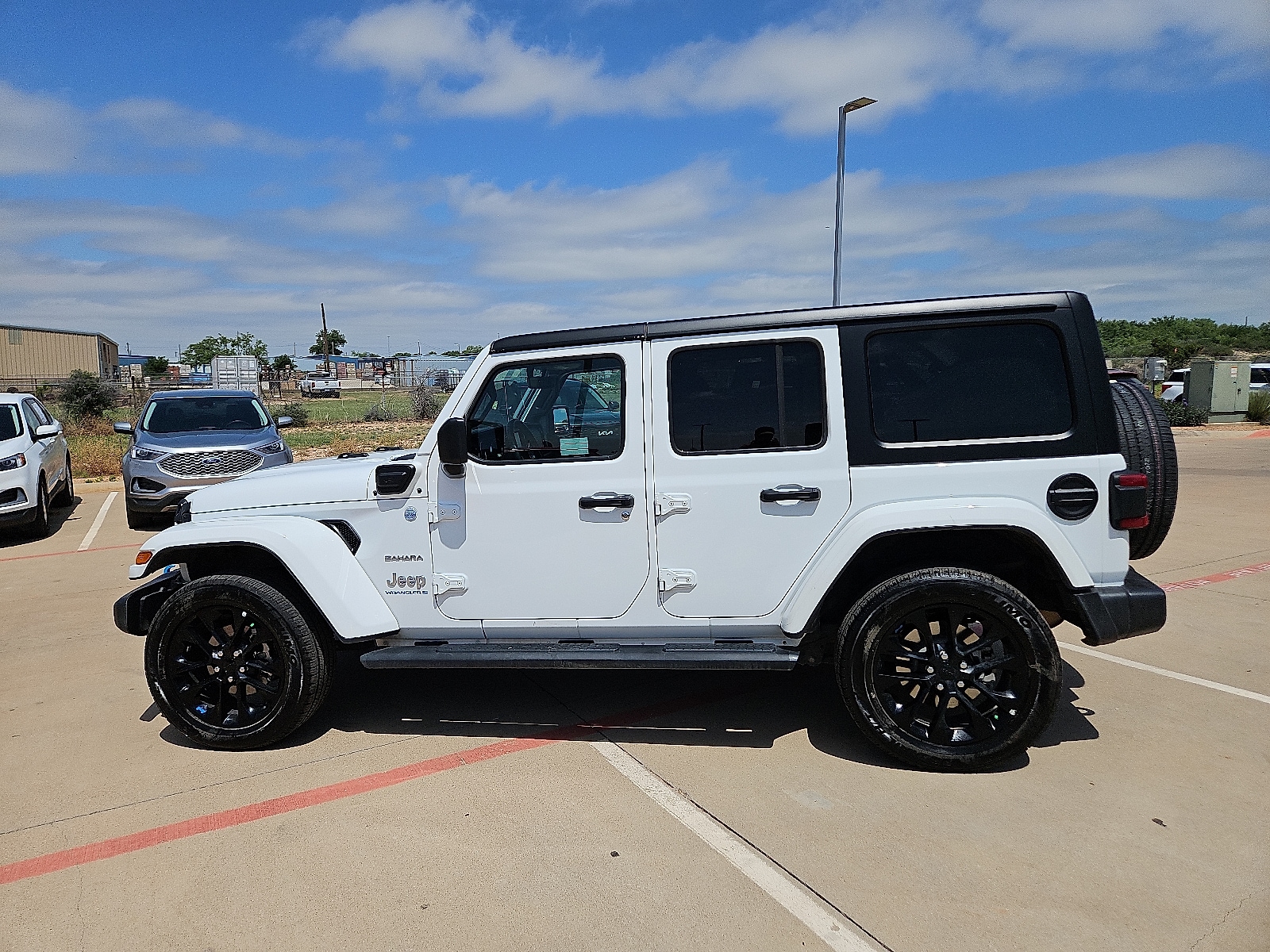 Used 2023 Jeep Wrangler 4xe Sahara 4XE with VIN 1C4JJXP67PW661116 for sale in San Angelo, TX