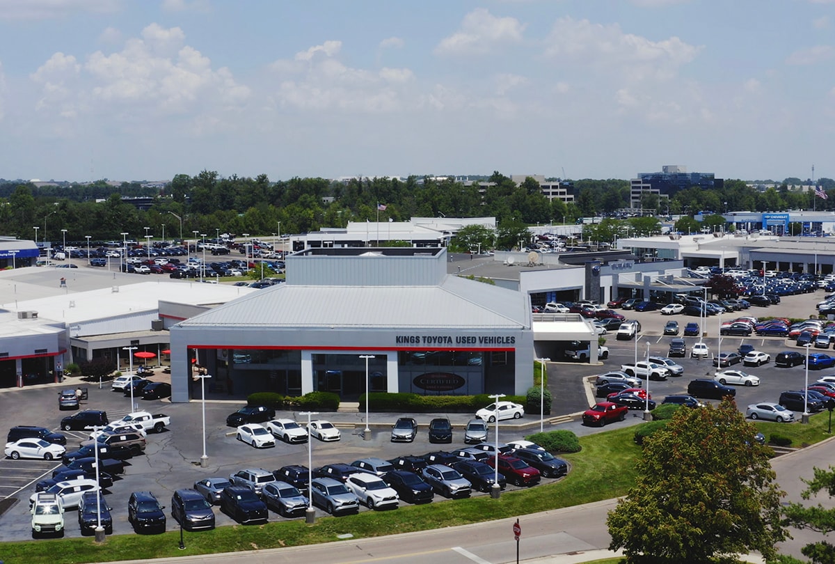  Person cheerfully signing documents.