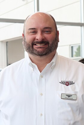 Staff member Greg from 602e0306781a