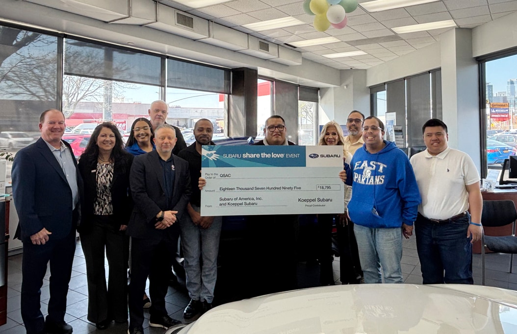 Koeppel Subaruâs check turnover of $18,795 donation to QSAC