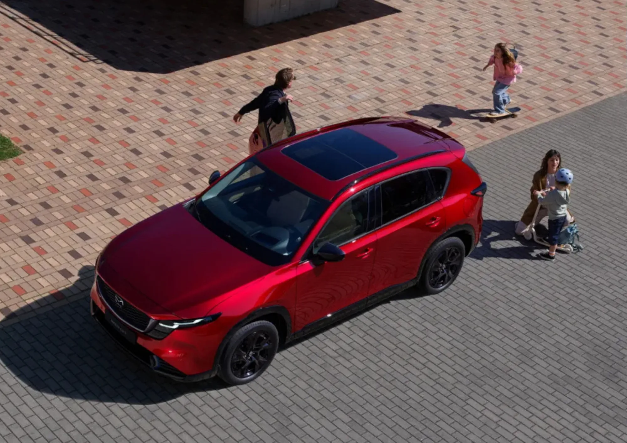 Family gathered around the 2026 Mazda CX-5 for a road trip