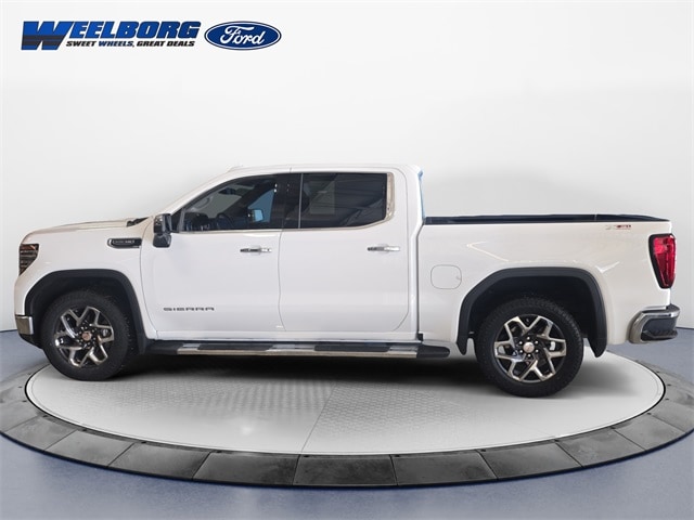 Used 2024 GMC Sierra 1500 SLT with VIN 1GTUUDEDXRZ148920 for sale in Redwood Falls, Minnesota