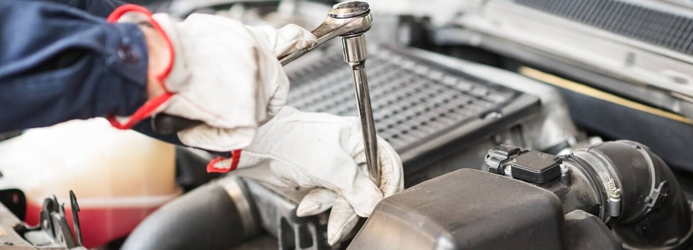 Mechanic working on a car engine