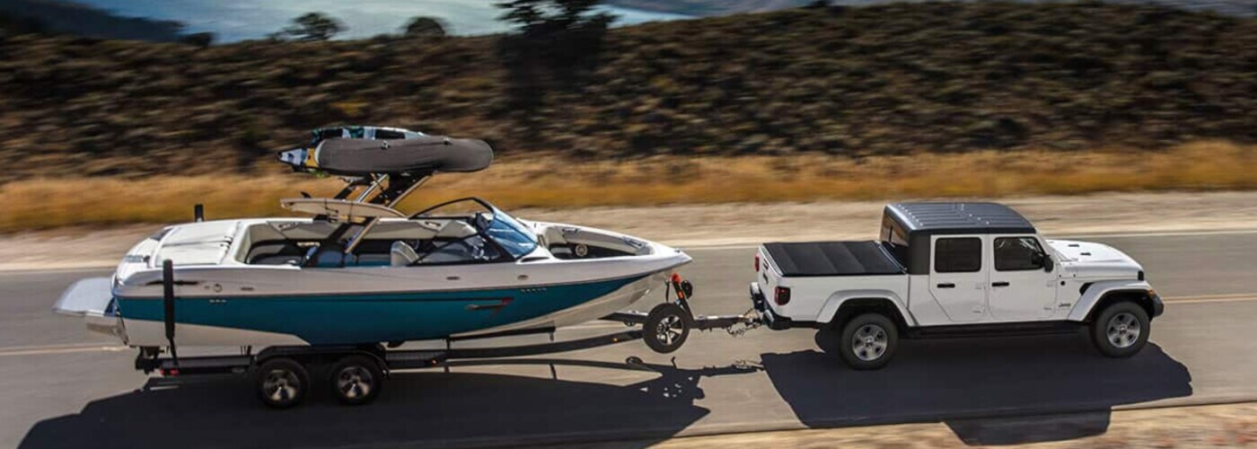 2023 Jeep Gladiator towing a boat