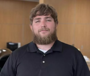 Staff member Jordan Worm from 4d011775870a