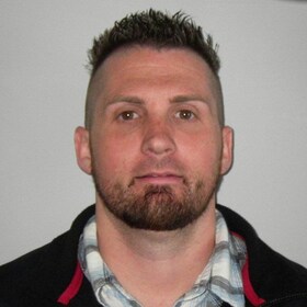 Staff member JUSTIN BROWN from c67c83431651