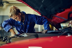 Mechanic Fixing a Range Rover