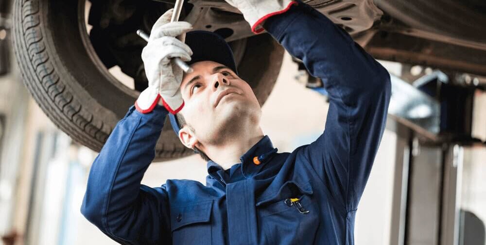 Technician Working on Vehicle