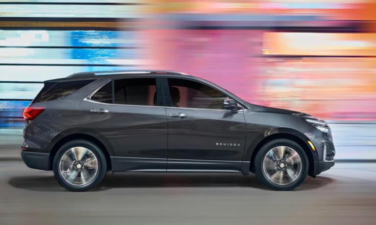 2022 Chevy Equinox exterior driving with colorful motion blur background