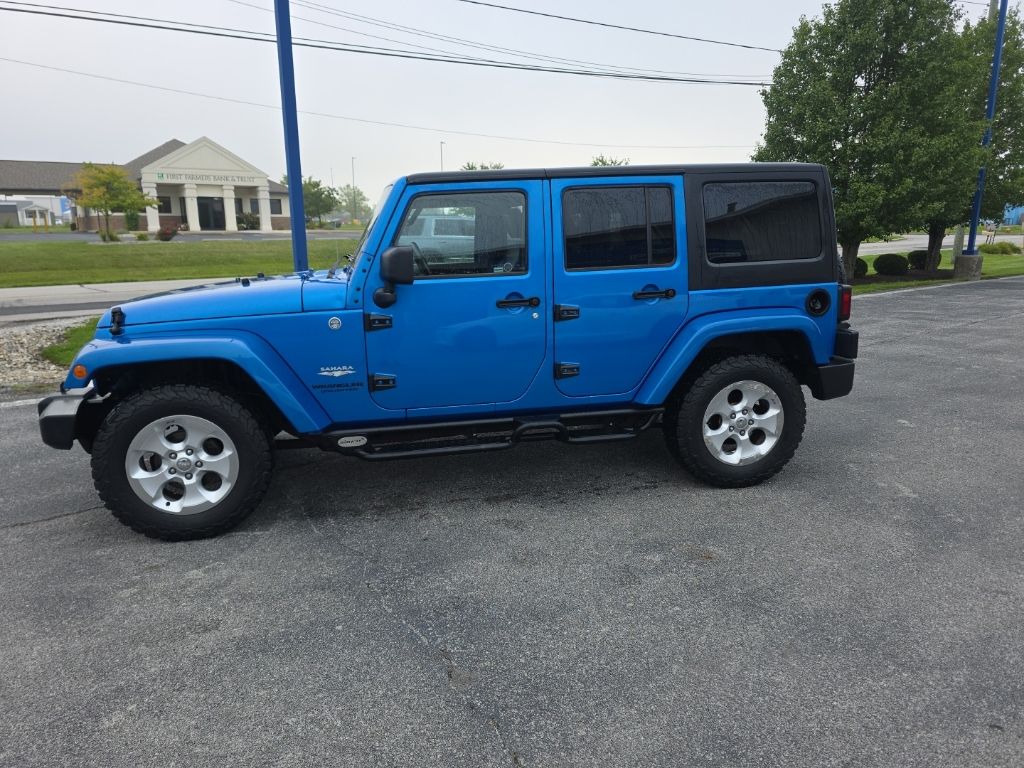Used 2015 Jeep Wrangler Unlimited Sahara with VIN 1C4HJWEG5FL515589 for sale in Huntington, IN