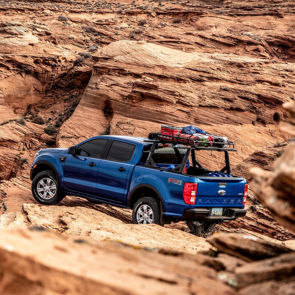 Ford Ranger fitted with offroad equipment driving offroad
