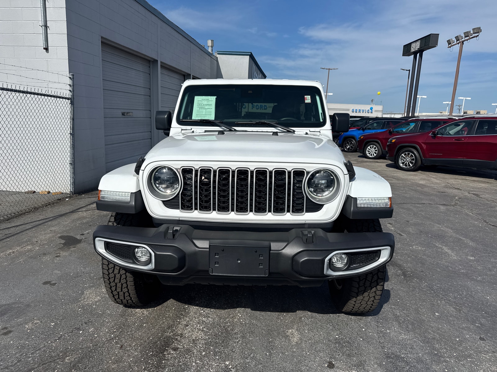 Used 2024 Jeep Wrangler 4-Door Sahara with VIN 1C4PJXEN2RW257857 for sale in Kansas City