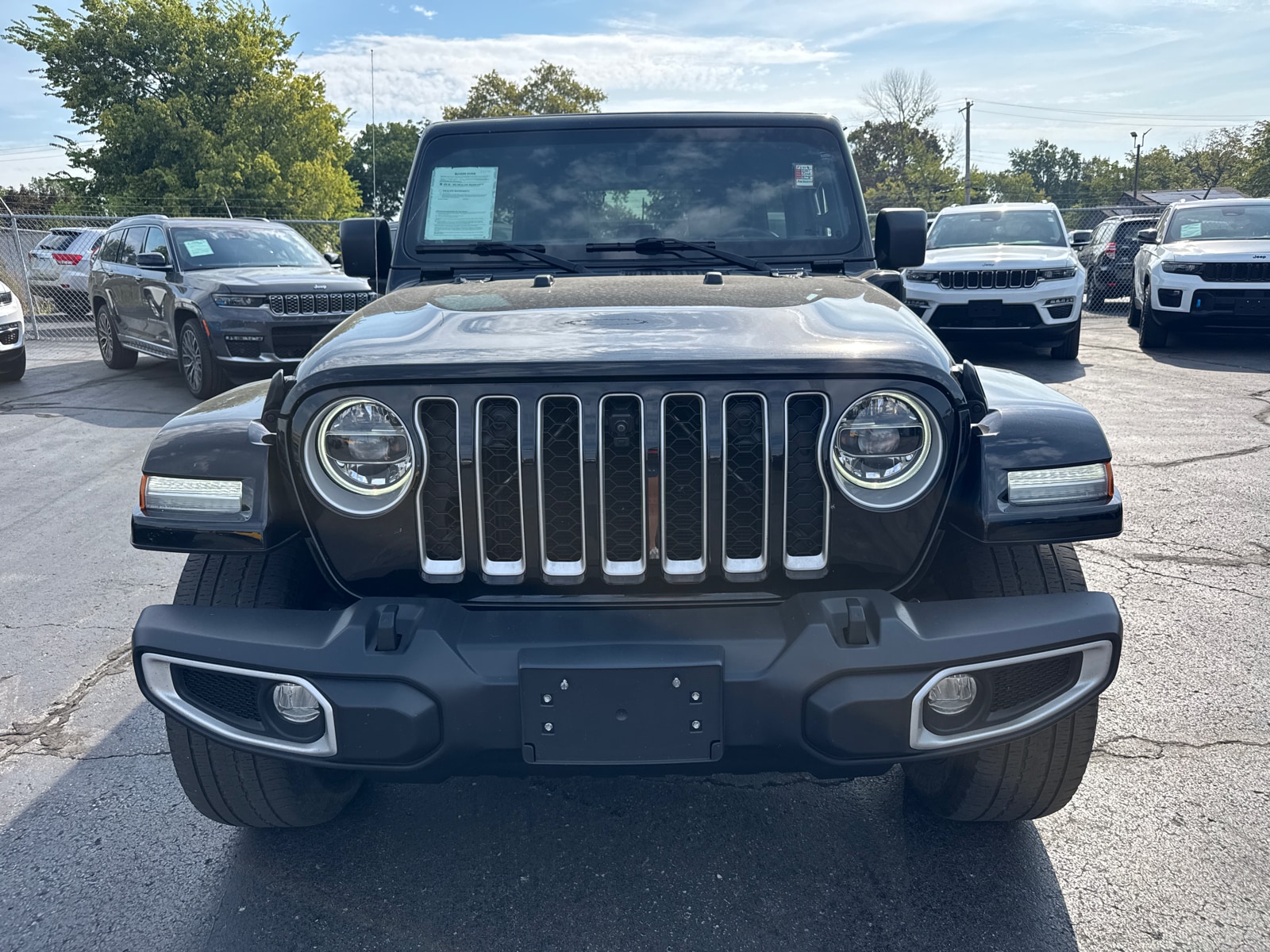 Used 2021 Jeep Wrangler Unlimited Sahara 4XE with VIN 1C4JJXP69MW802490 for sale in Kansas City