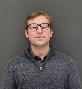 Staff member Charles Kneuvean from ID_a99ae2c52e29