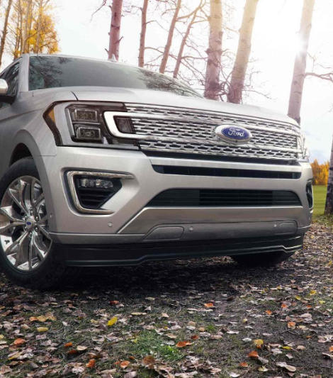 A silver 2018 Ford Expedition parked close to the camera