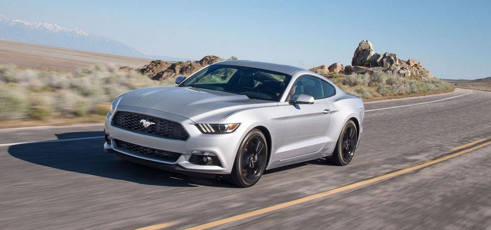 2017 Mustang driving fast down a highway