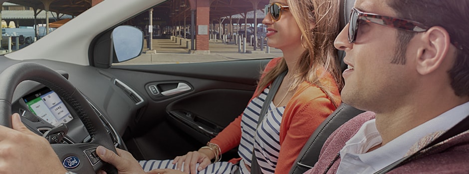 People driving in a Ford with the SYNC Infotainment System