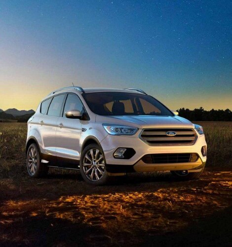 A silver 2018 Ford Escape parked near a campfire